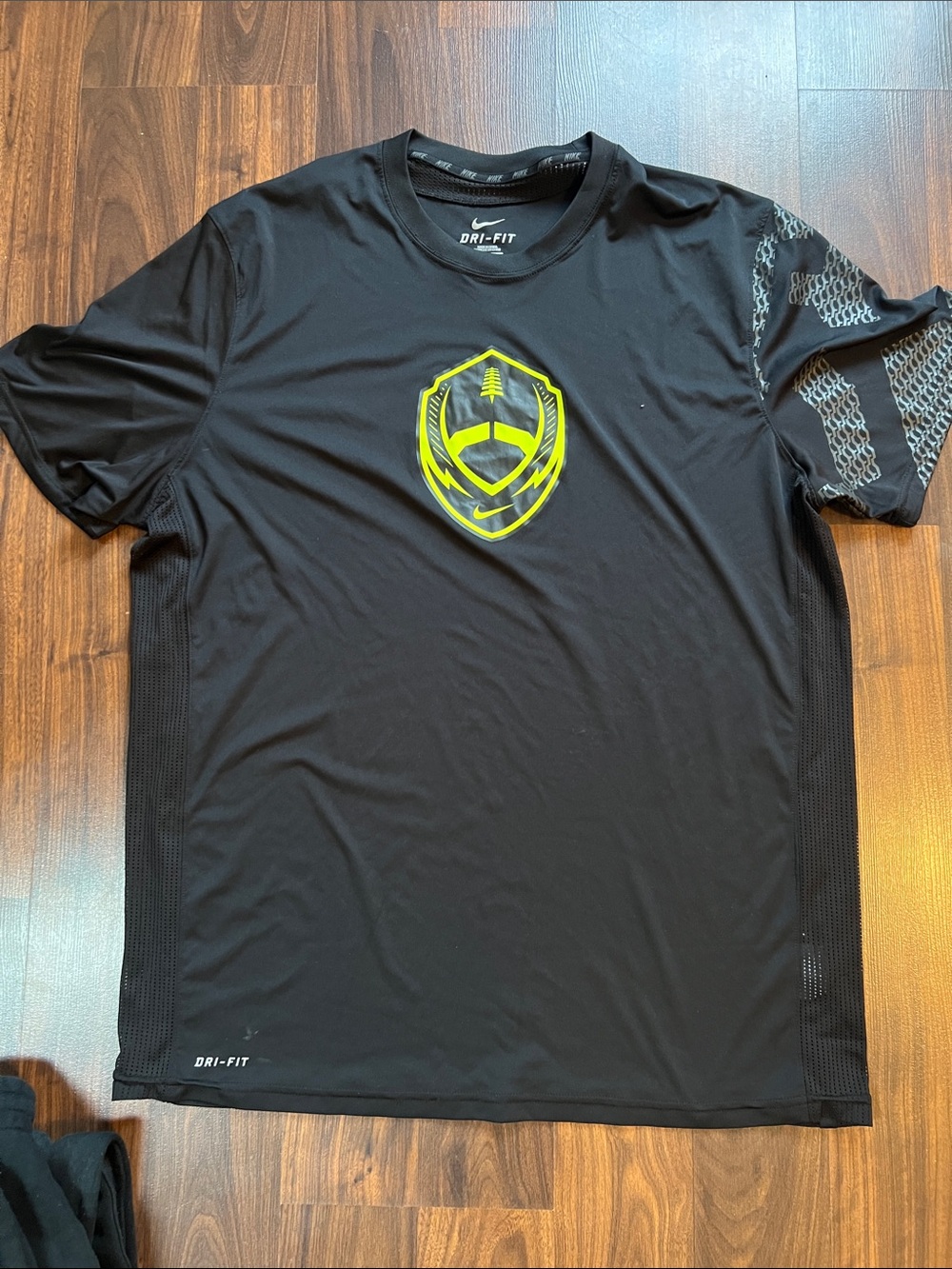 Nike Black Short-Sleeve Dri-FIT Shirt with Neon Yellow Chest Emblem